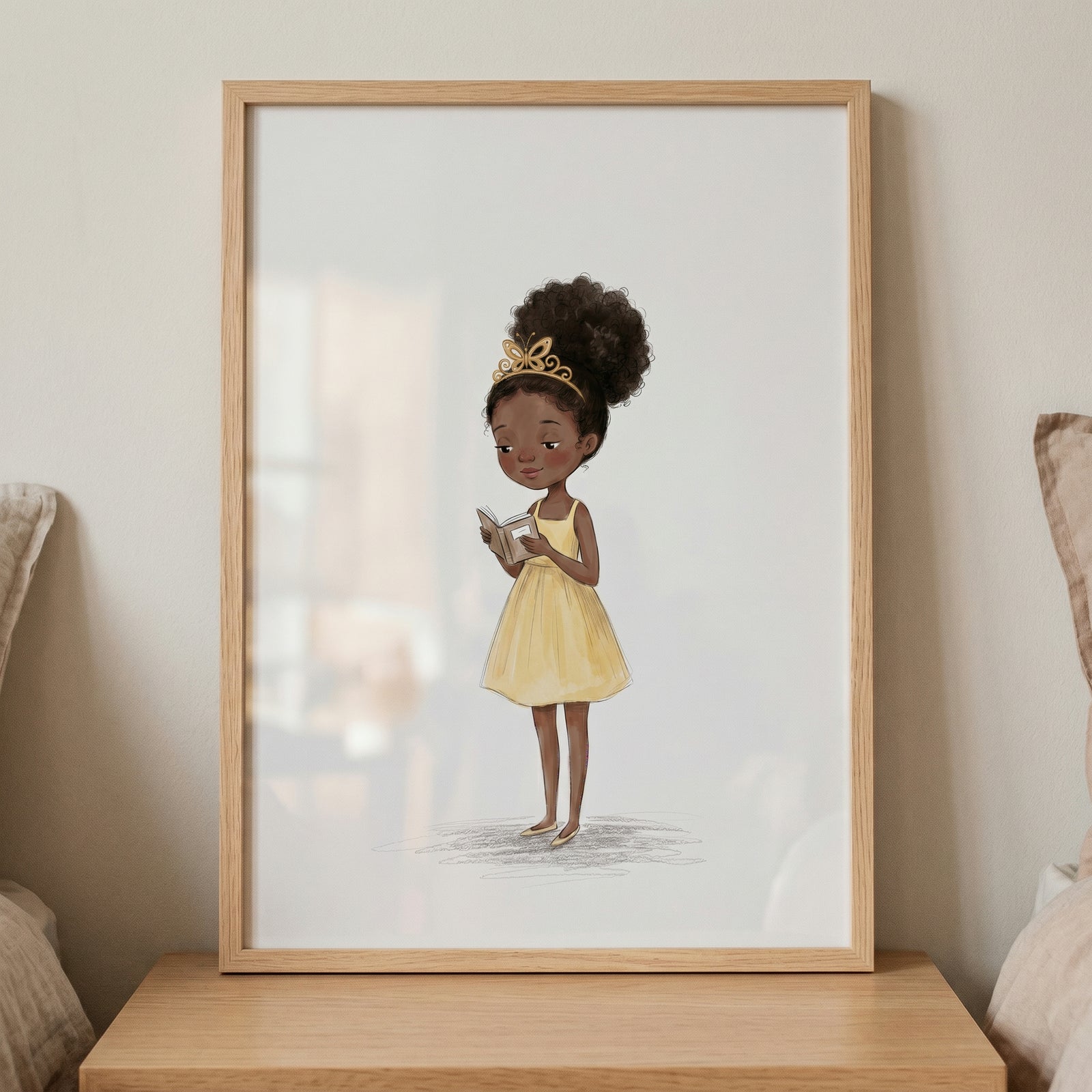 Framed yellow dress reading girl wall art of a girl with a gold tiara and dark curly hair reading a book.