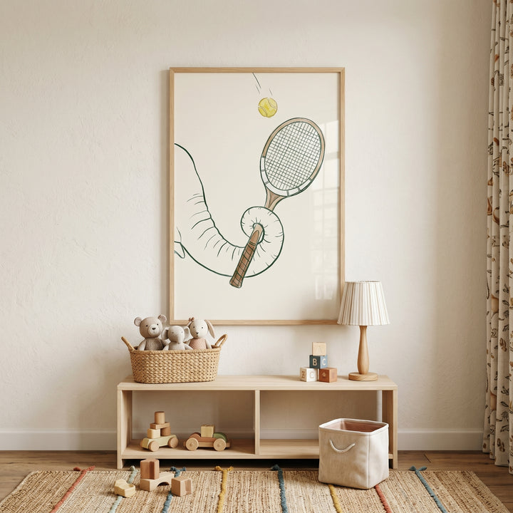 A yellow tennis ball elephant print hangs above a wooden shelf with toys, a lamp, and stuffed animals in a nursery.