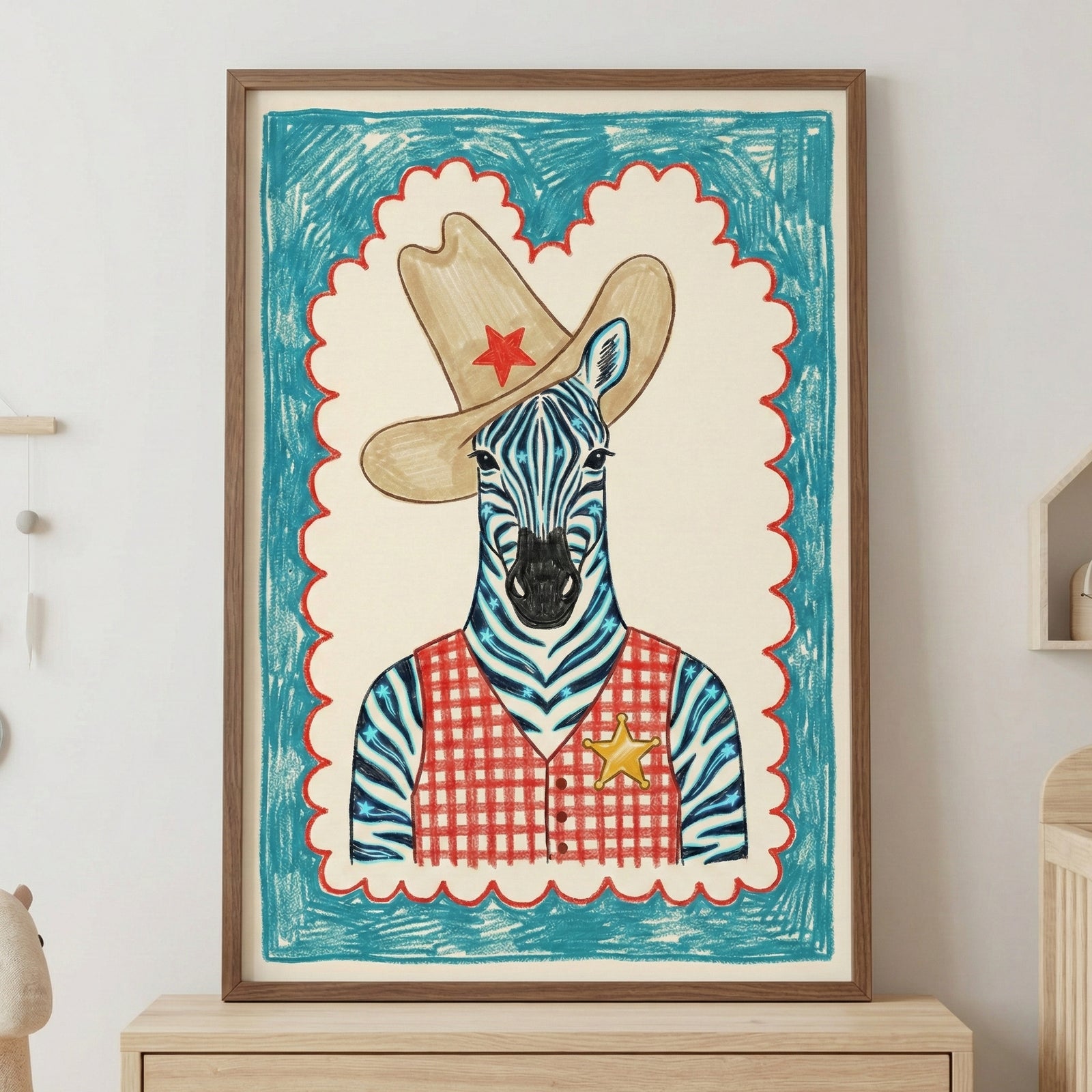A framed illustration of a zebra dressed in a cowboy hat and a red checkered sheriff's vest is displayed in a bright nursery setting. The room includes a light wood crib with a blue blanket, a plush teddy bear on a jute rug, and a small stool with stacked books.
