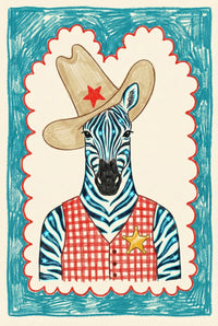 A colorful framed illustration of a zebra wearing a tan cowboy hat with a red star and a red checkered sheriff's vest is displayed in a bright nursery setting. The room includes a light wood crib with a blue blanket, a plush teddy bear on a jute rug, and a small stool with stacked books.